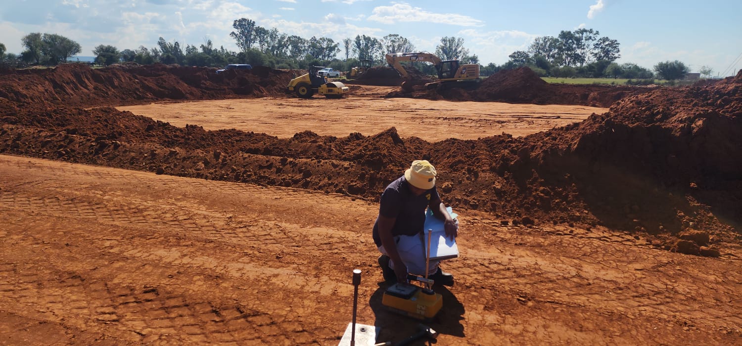Site engineer running a compaction test during bulk earthworks