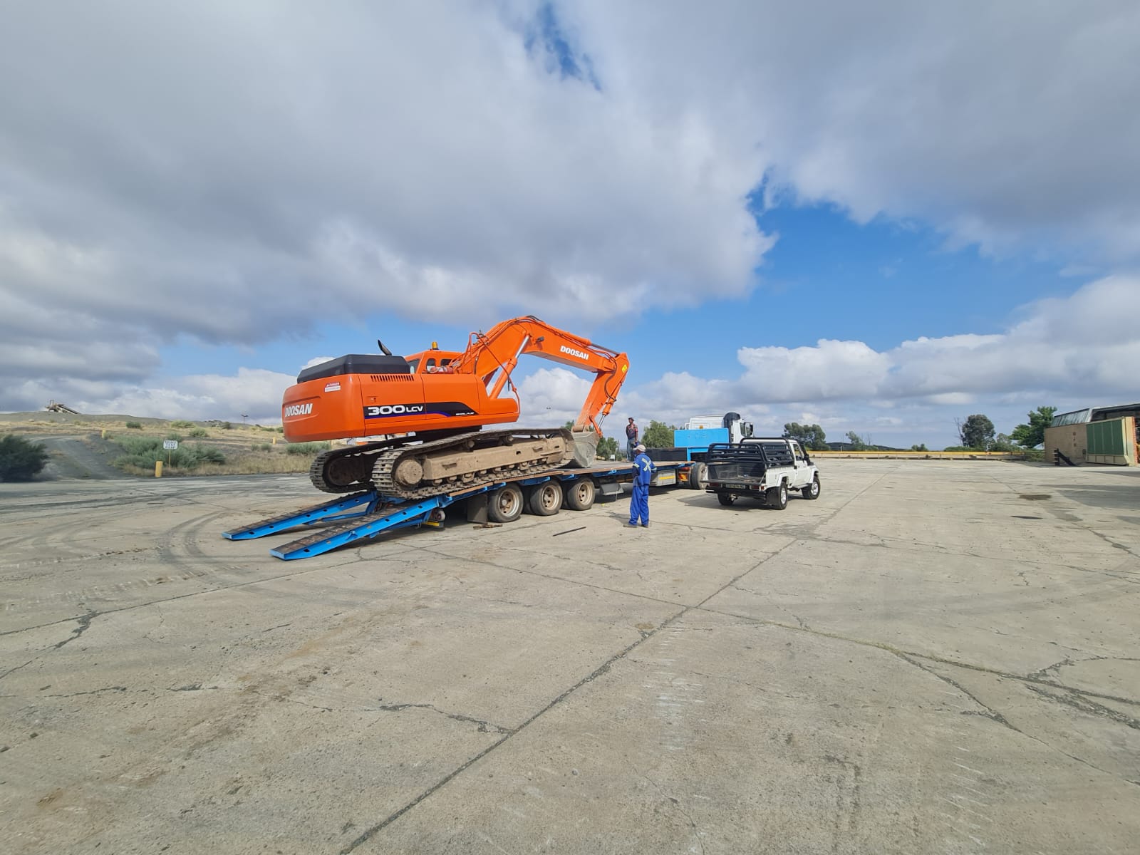 Aurex tracked excavator loaded for low-bed transport